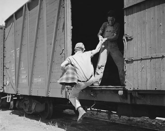 Hobo pulled into boxcar
